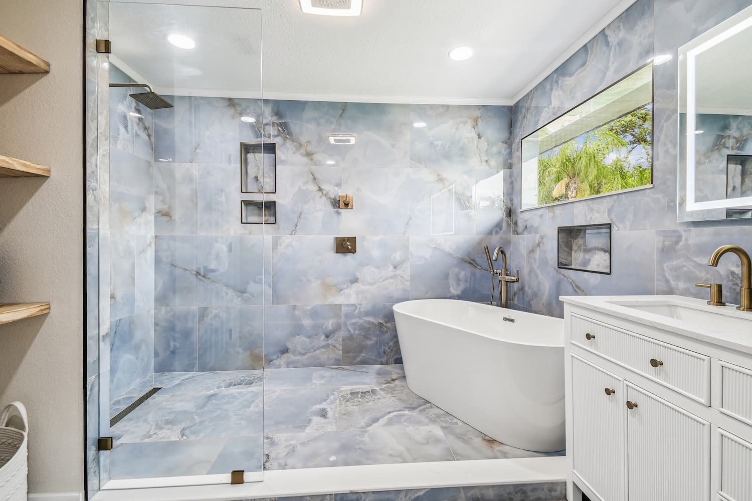 Blue marble bathroom with freestanding tub