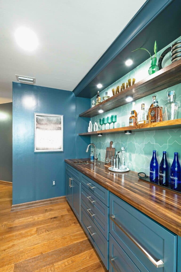 Custom home bar with millwork and pendant lighting in a Tampa whole home renovation