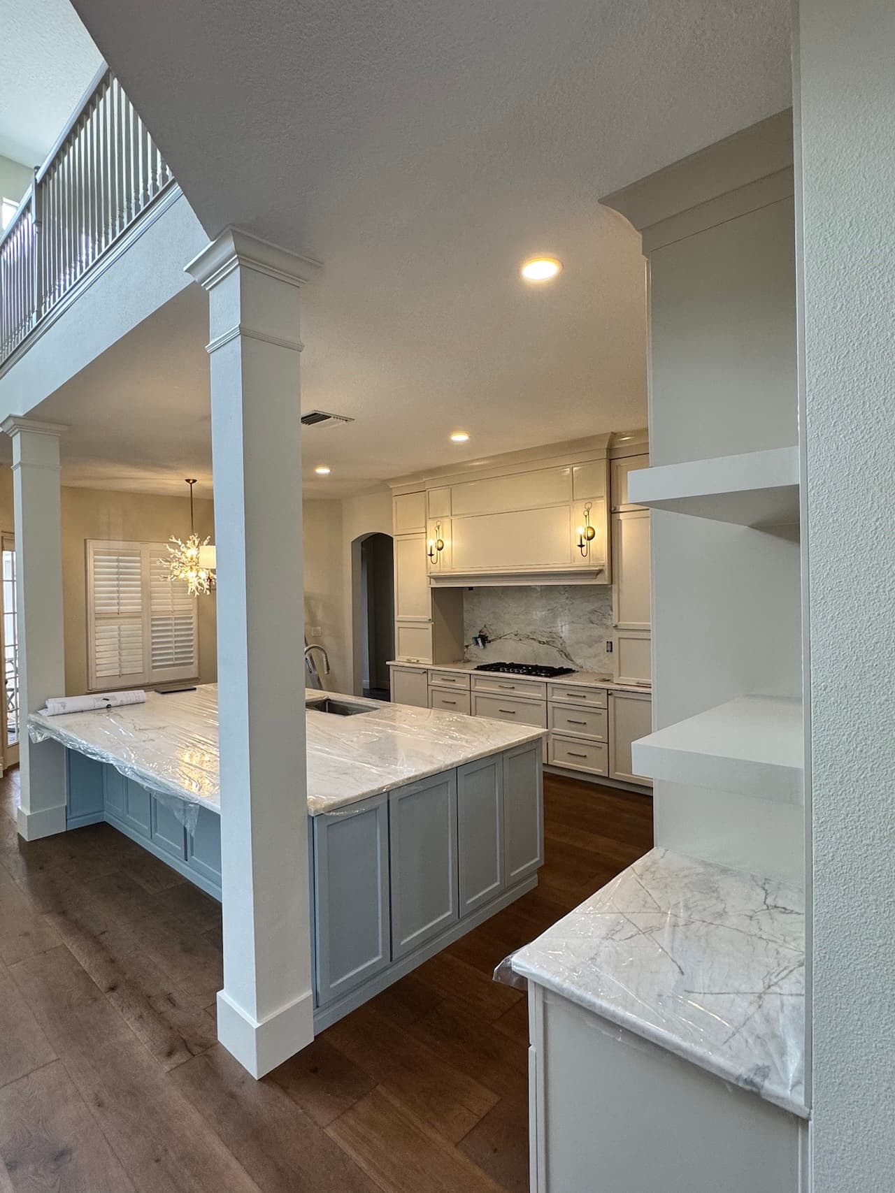 Kitchen remodel with marble countertops and gray island in Tampa