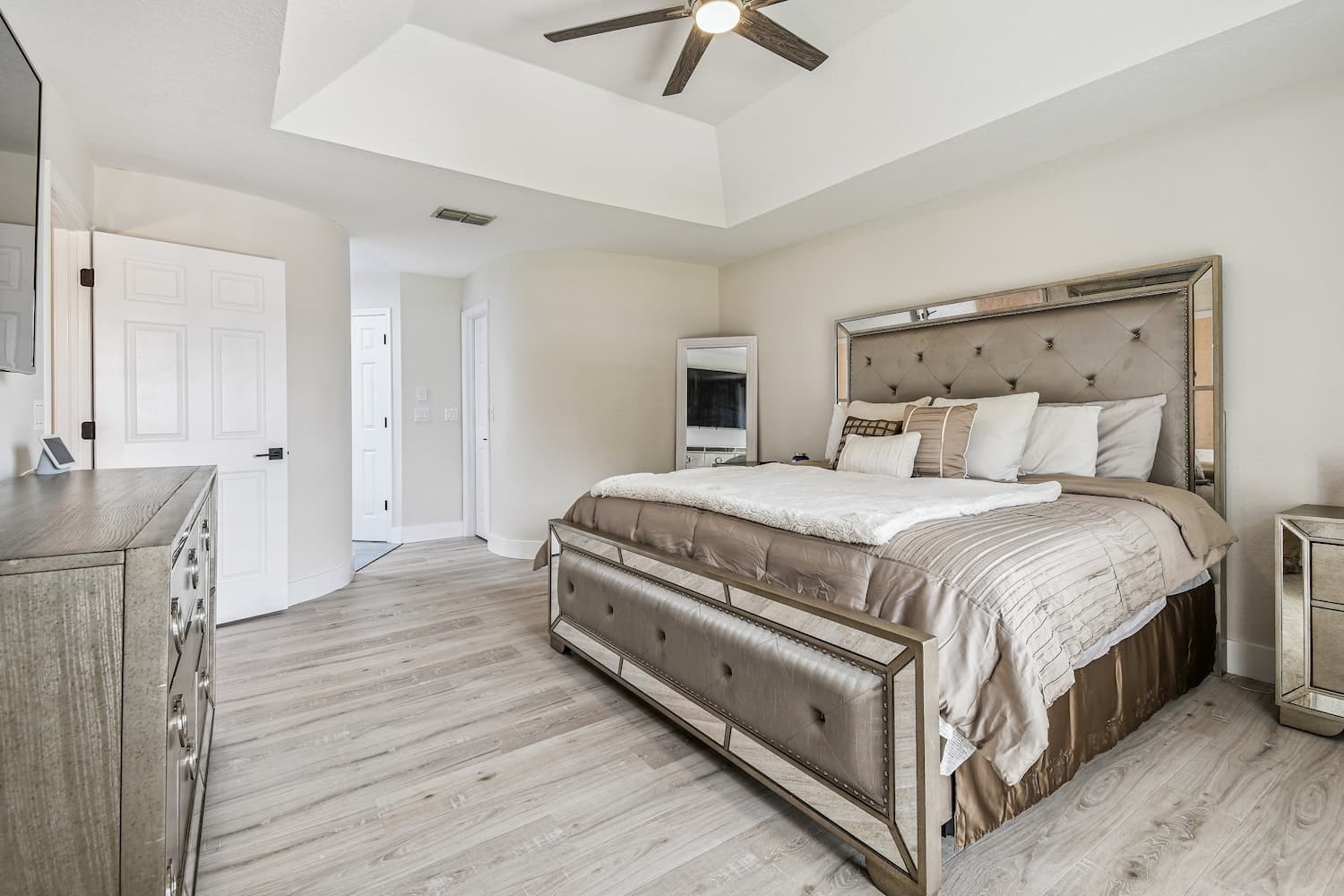 Tampa primary bedroom renovation with tray ceiling and custom furnishings