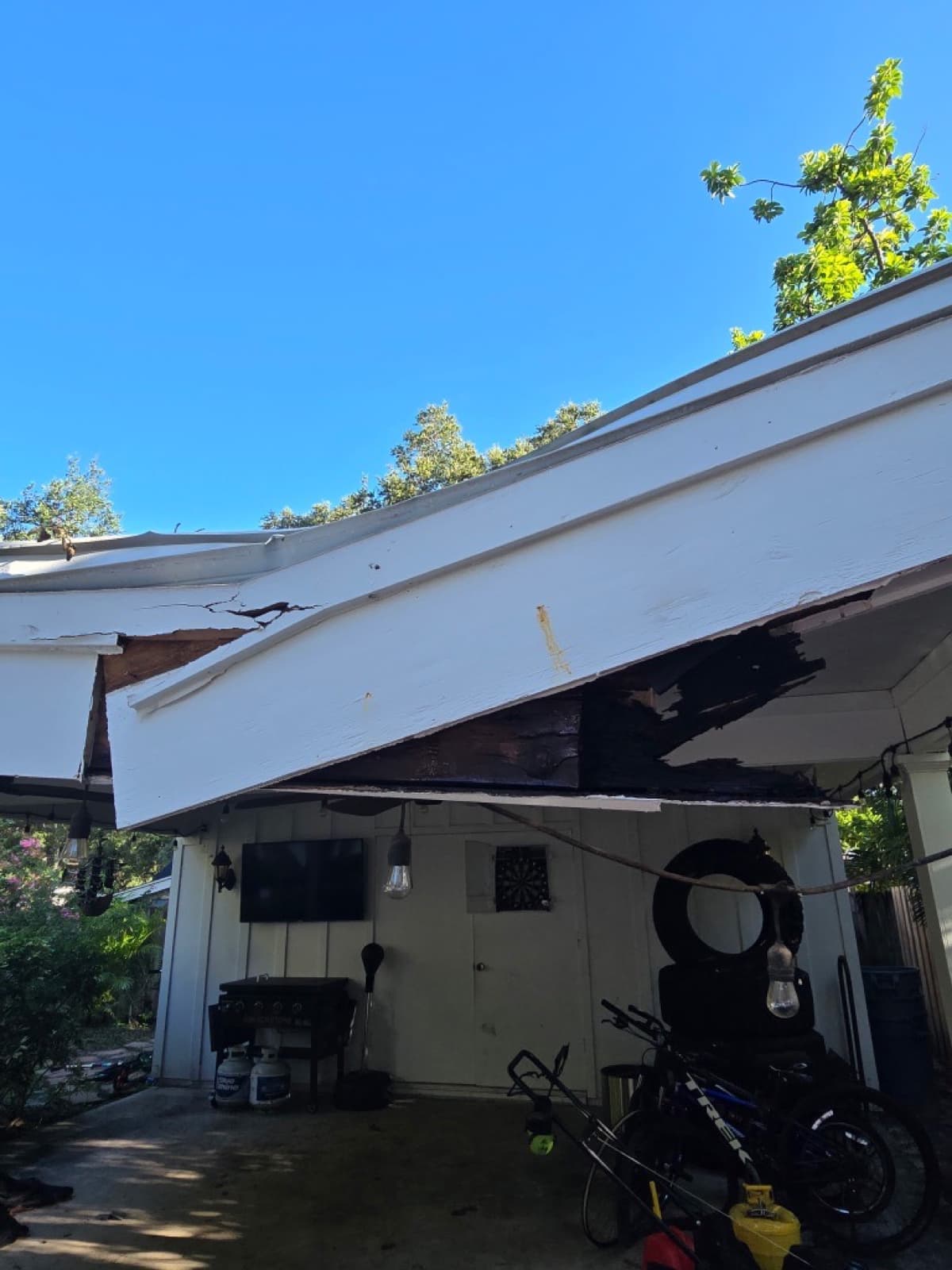 Carport roof and fascia damage before repair in Tampa