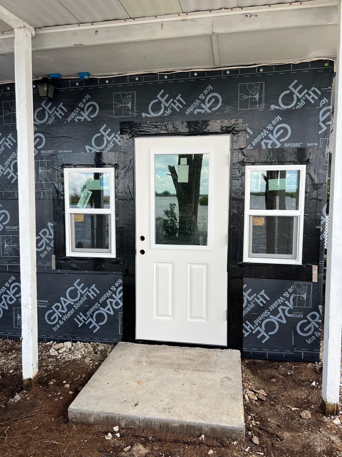 Exterior door and window installation with weather wrap in Tampa